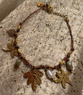 BRACELET FIN DORÉ PENDENTIFS EXOTIQUES